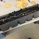 Customized valve cover for the BMW engine.